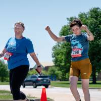 Two participants crossing the finish line.